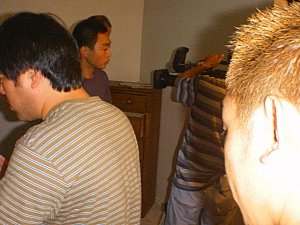 Crew shuffles equipment on the set